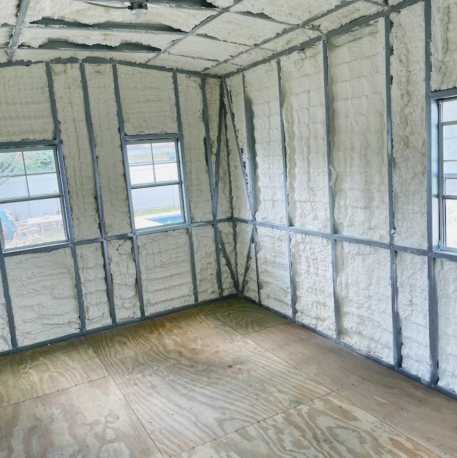 Closed-cell spray foam insulation applied to wall cavities in a residential project in Thornapple